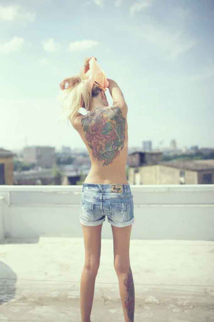 Back tattoo and sky