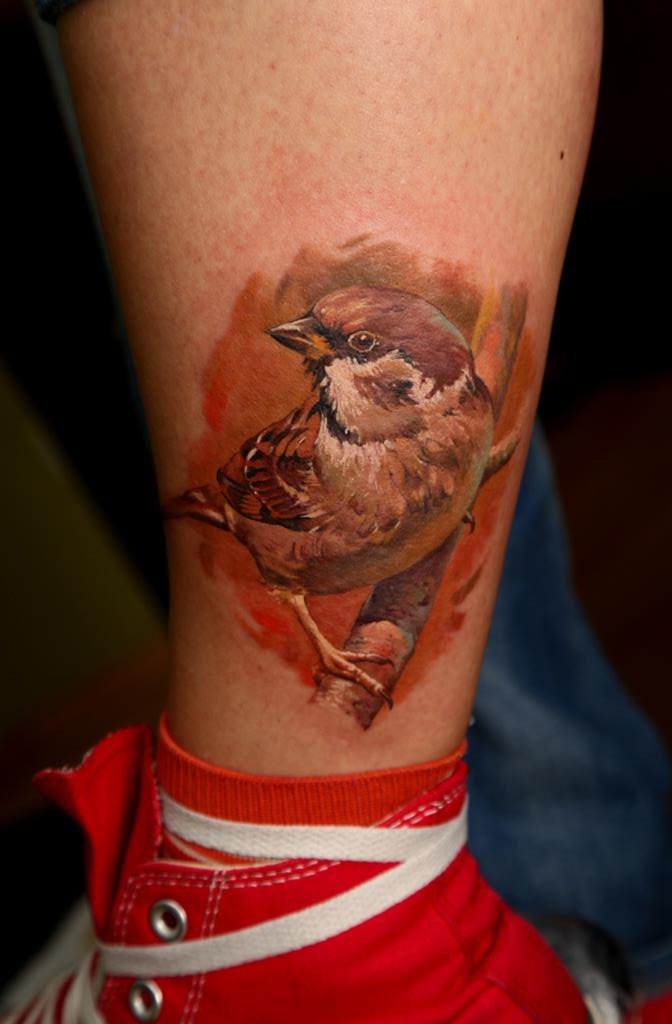 Sparrow on a Brunch realistic tattoo on leg