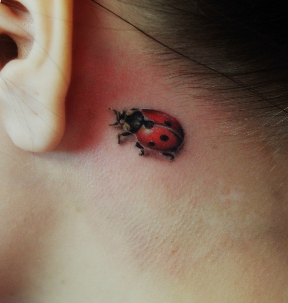 Tiny Ladybug Behind the Ear 3D tattoo