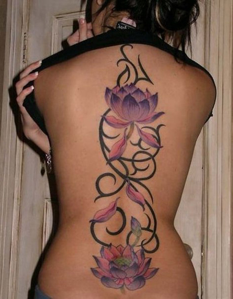 Falling petals back tribal tattoo