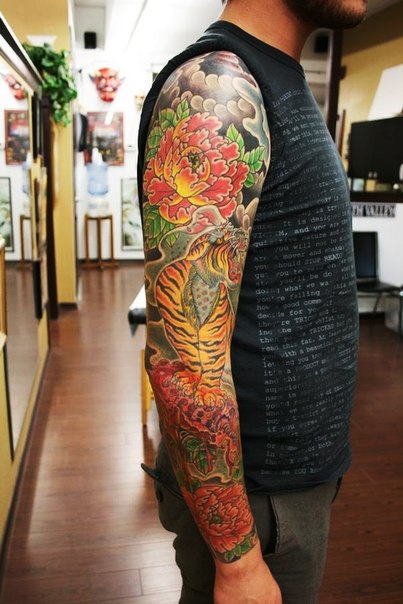 Red Flowers and Growling Tiger Japanese tattoo sleeve