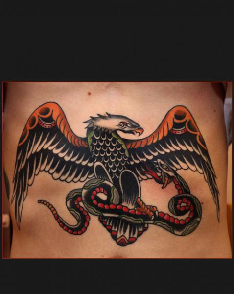 Eagle attacks Snake chest tattoo by Chapel tattoo