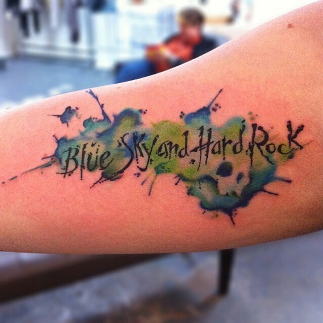 Aquarelle Blue Sky and Hard Rock Lettering tattoo by Jason Middelton