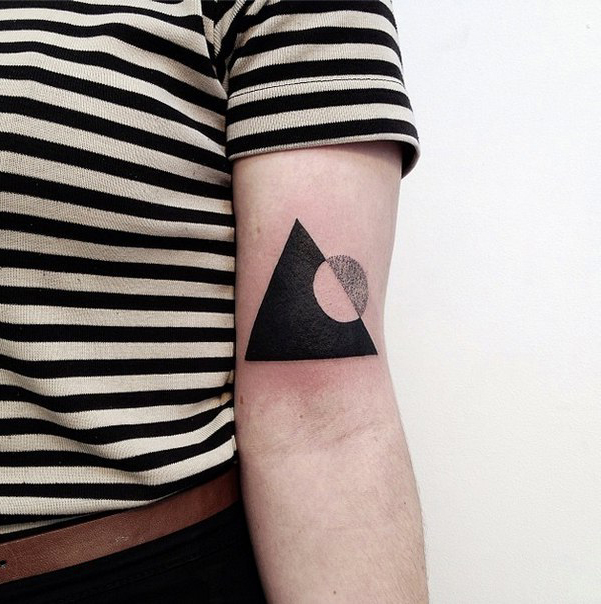 Circle and Triangle Blackwork tattoo near Elbow