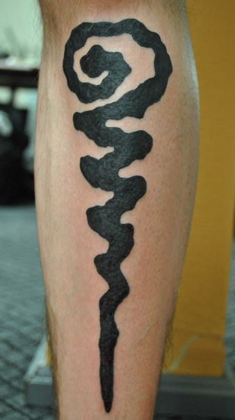 Curly Sign Blackwork tattoo