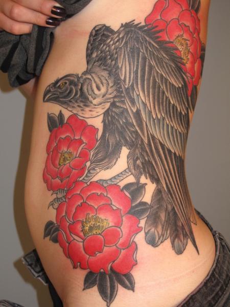 Red Flowers Vulture tattoo by Three Kings Tattoo