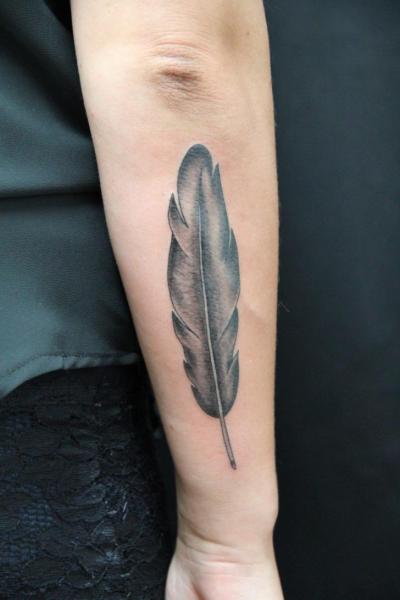 Single Feather Graphic tattoo by Skin Deep Art