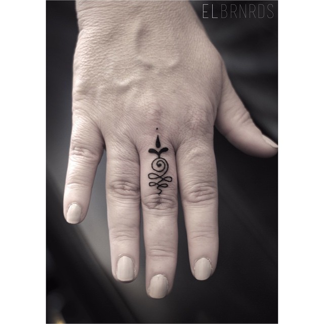 Cute Hindu Ornament Small Tattoo on Finger