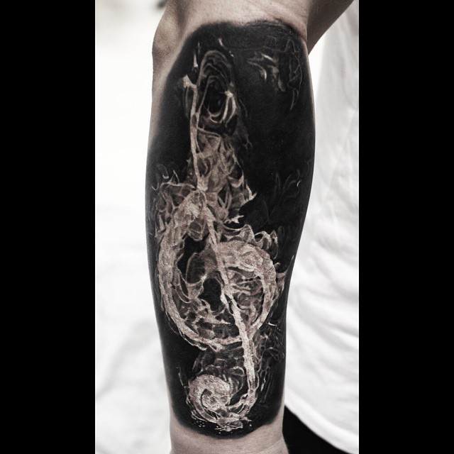 Graphic Fire Treble Clef Tattoo