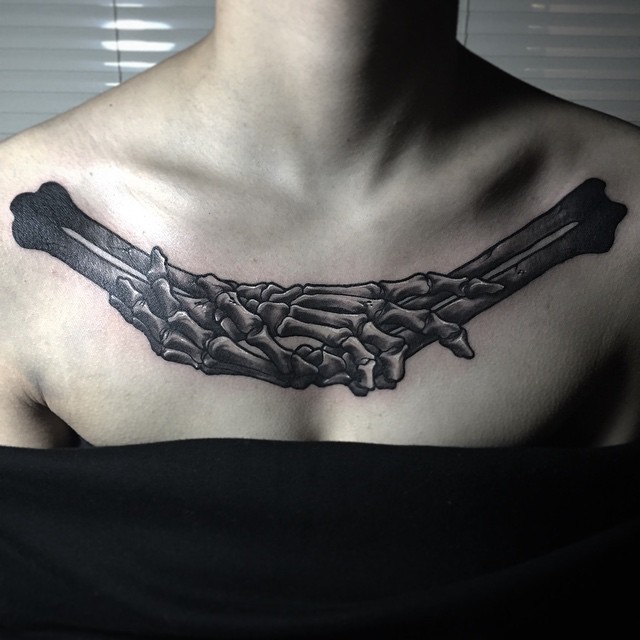 Holding Hands Skeleton Chest Tattoo