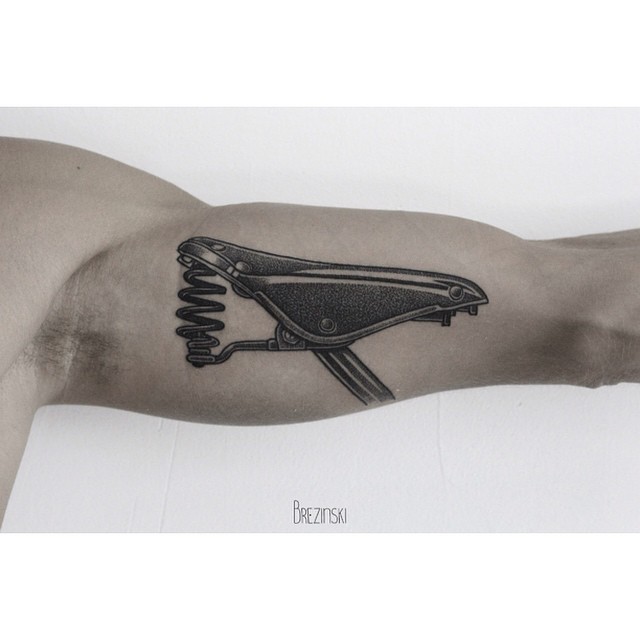 Bicycle Saddle Tattoo on Arm