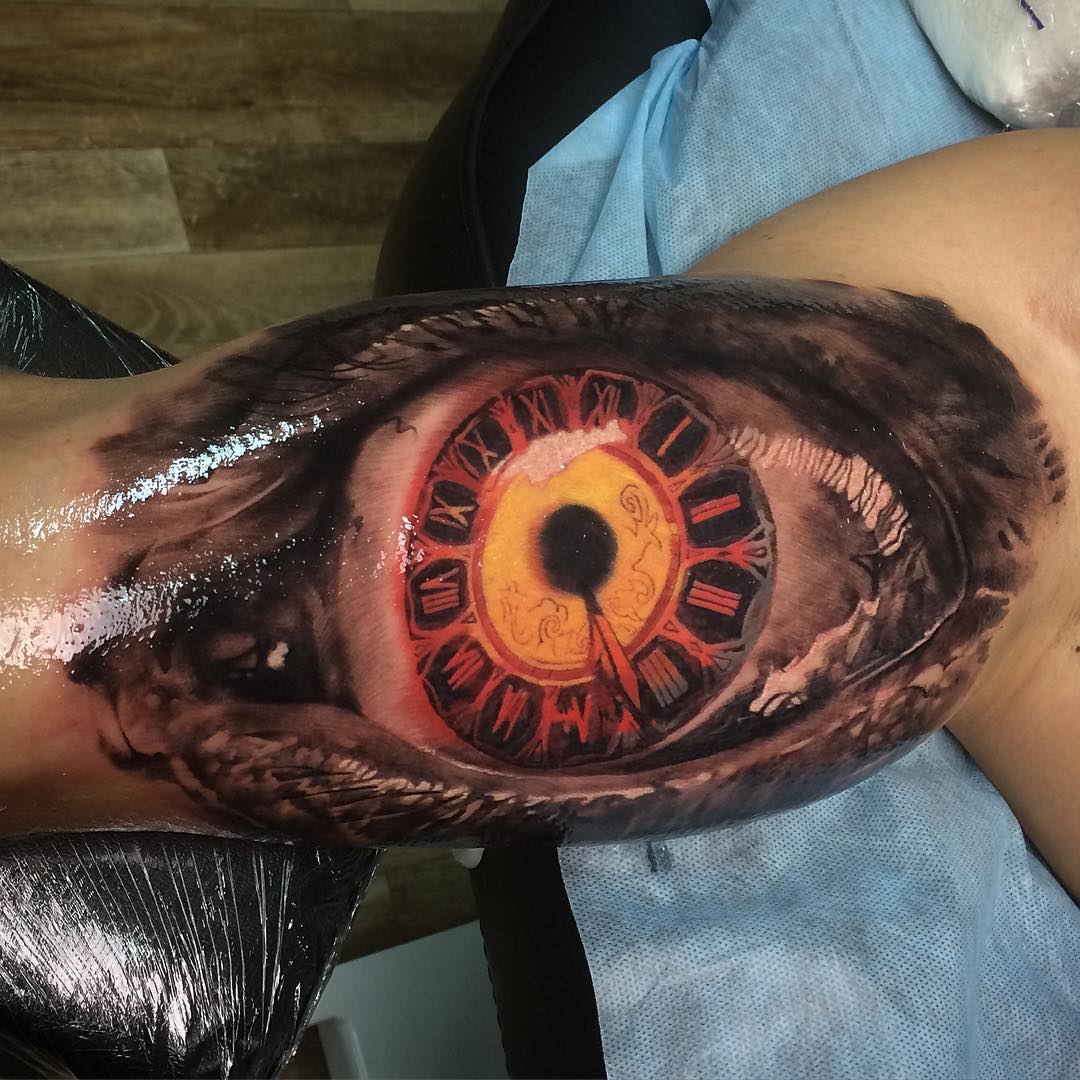 the cloackface in the eye tattoo on bicep