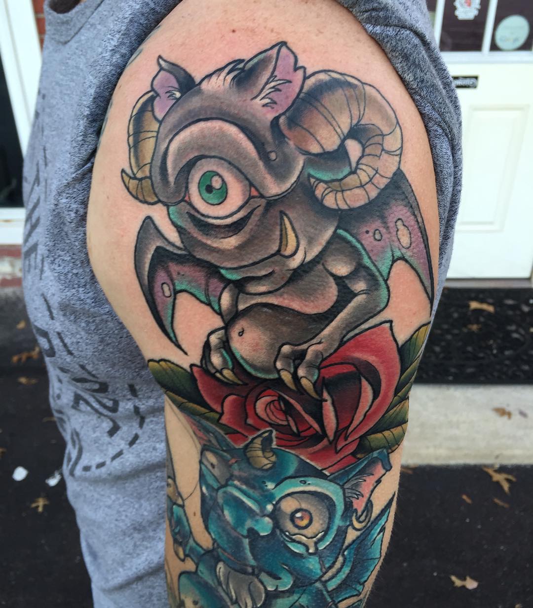 one-eyed new school imp tattoo on shoulder