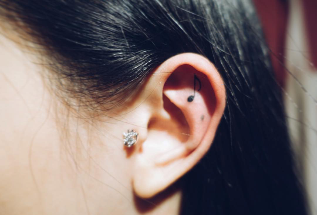 small ear tattoo note