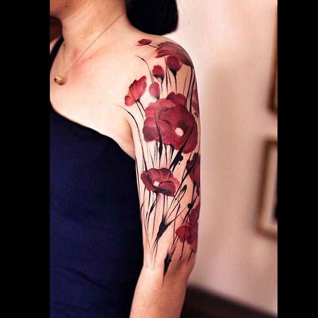 many red poppy flowers on shoulder