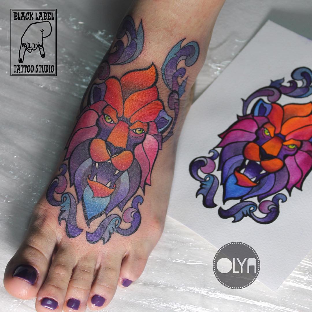 lion tattoo on foot