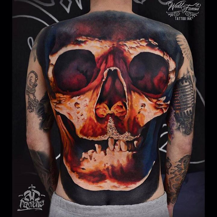 dull back tattoo of a realistic skulll