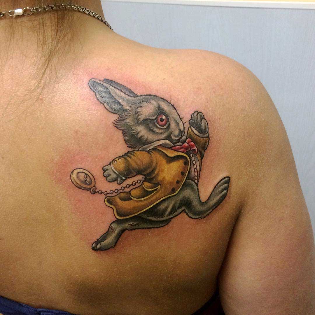 a shoulder blade tattoo of White Rabbit