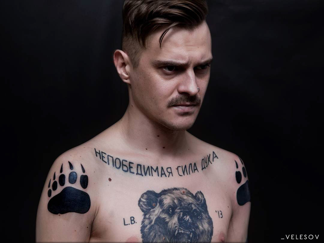 shoulders bear paw tattoos