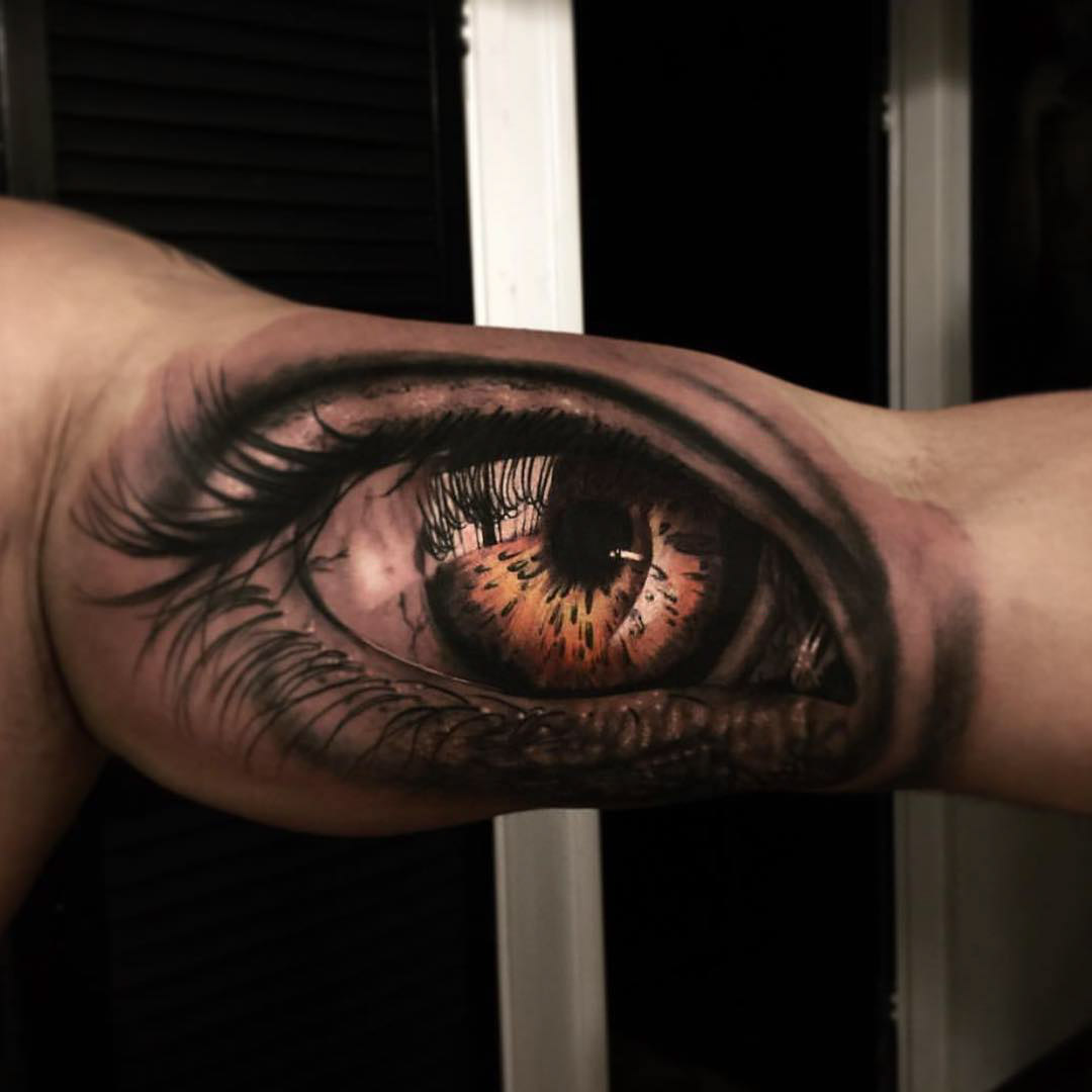 eye tattoo on bicep