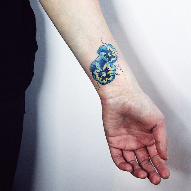 small flowers tattoo on wrist