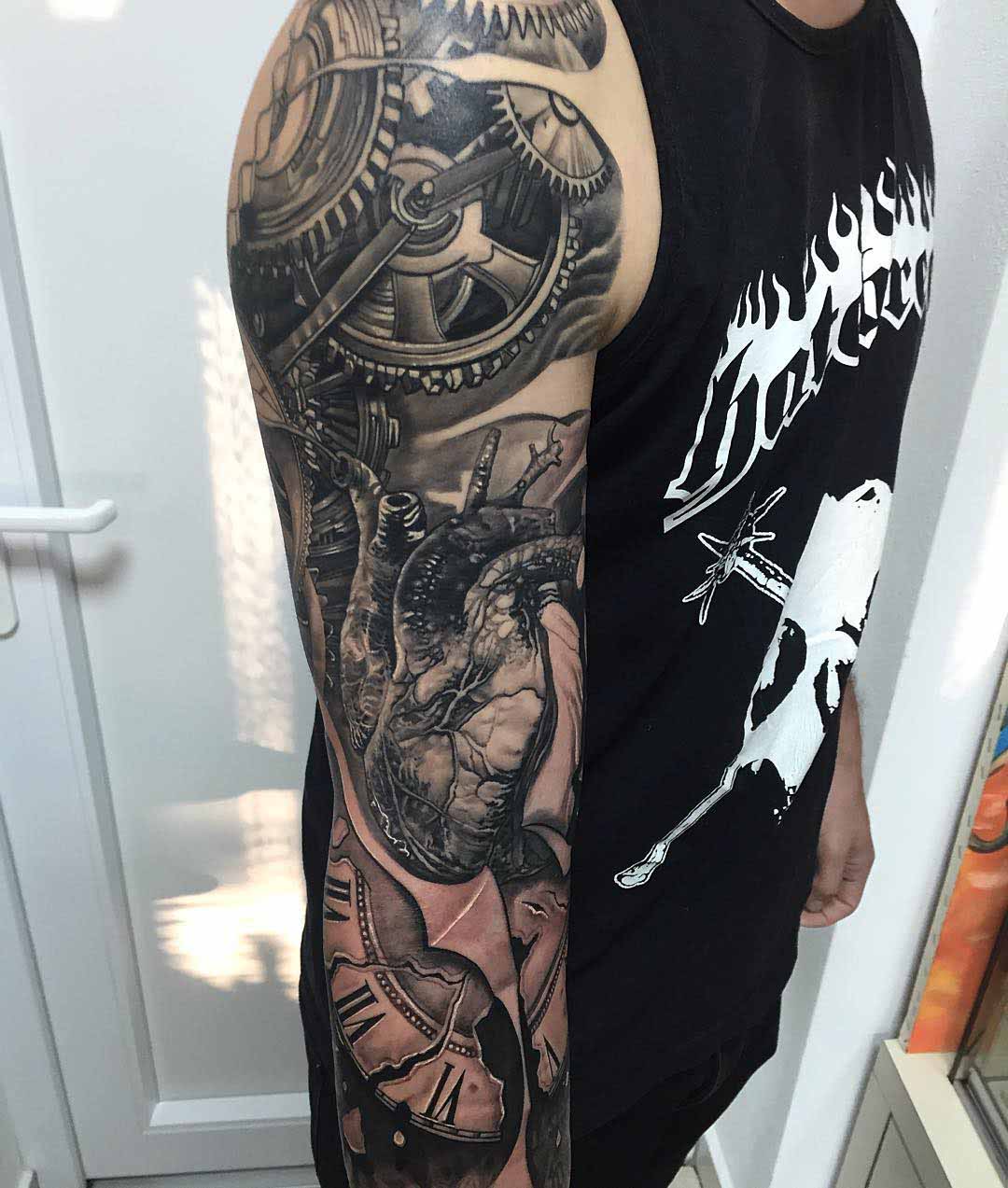 heart and cogwheels tattoo sleeve