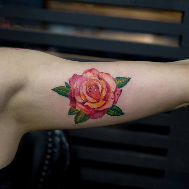 rose tattoo on arm