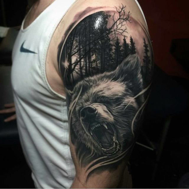 forest bear tattoo on shoulder