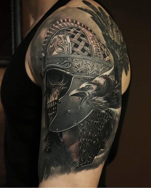 scandinavian warrior skull in helmet tattoo on shoulder