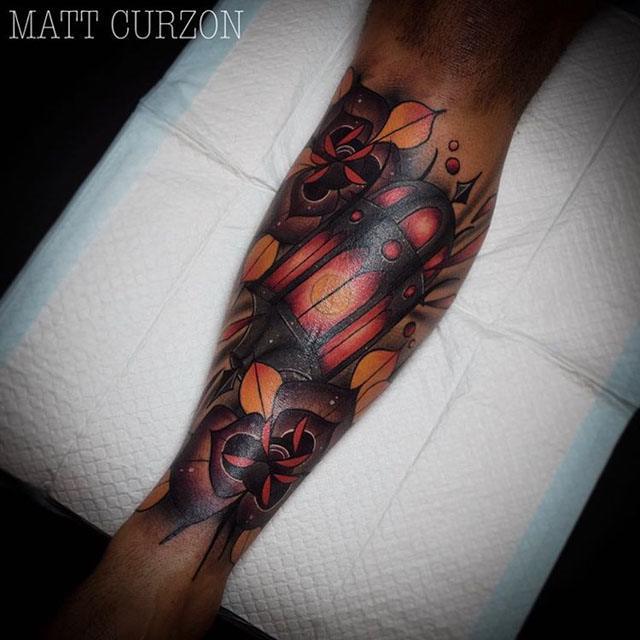 neo-traditional lantern tattoo on arm