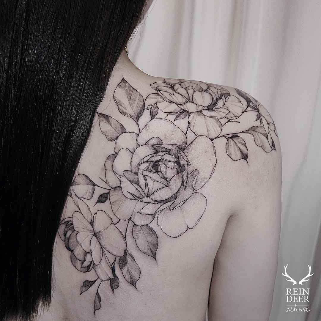 Shoulder blade flowers tattoo