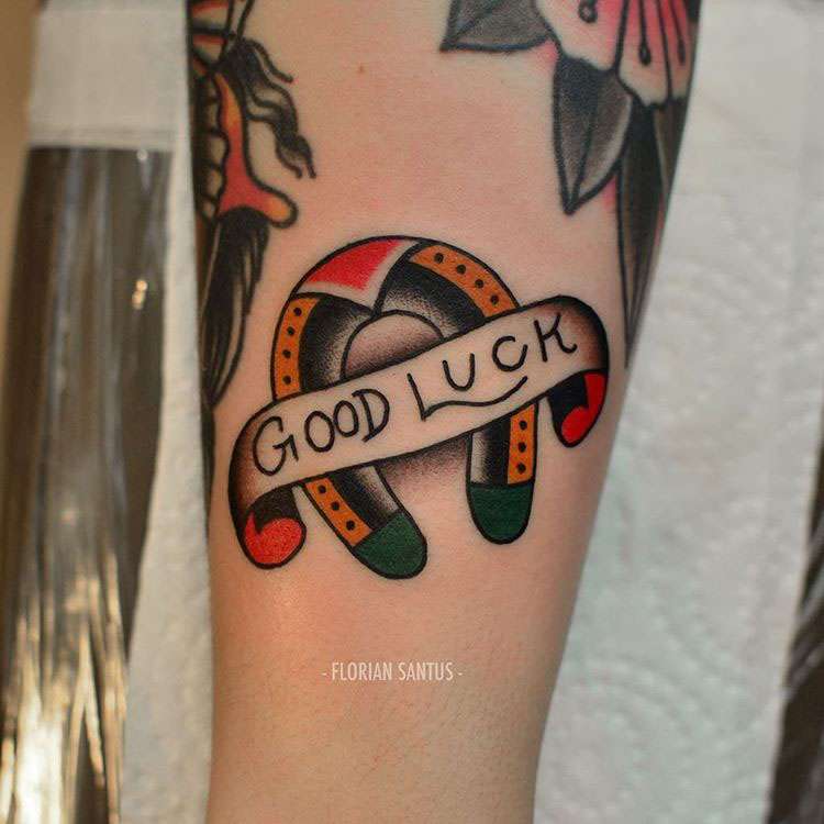 neo-traditional horseshoe tattoo good luck