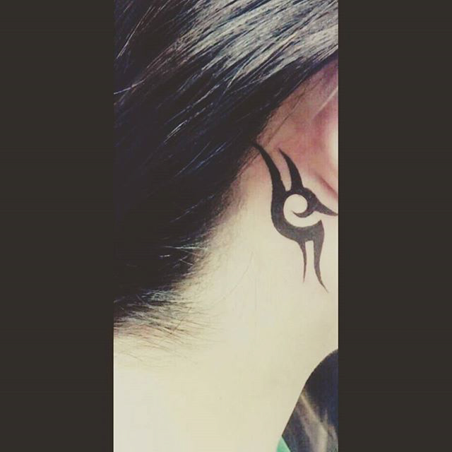 black Tribal Tattoo Behind Ear