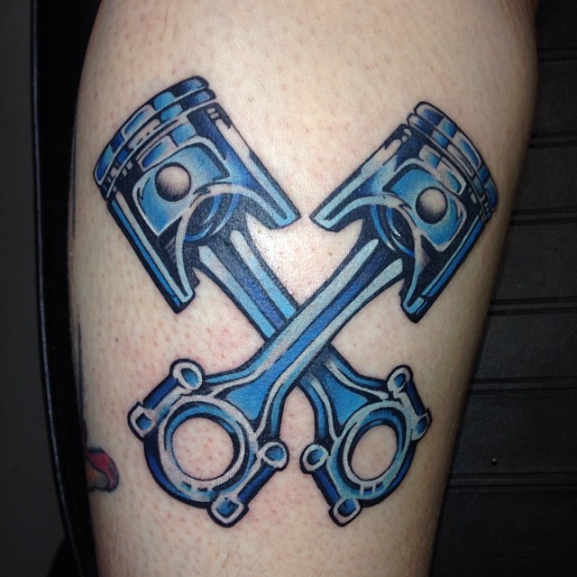 Crossed Pistons Tattoo by @studio77tattoo