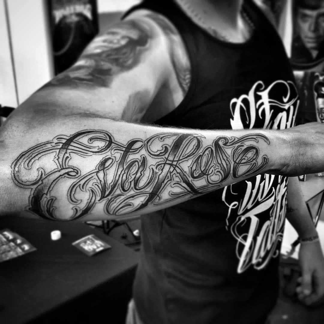 name tattoo on forearm