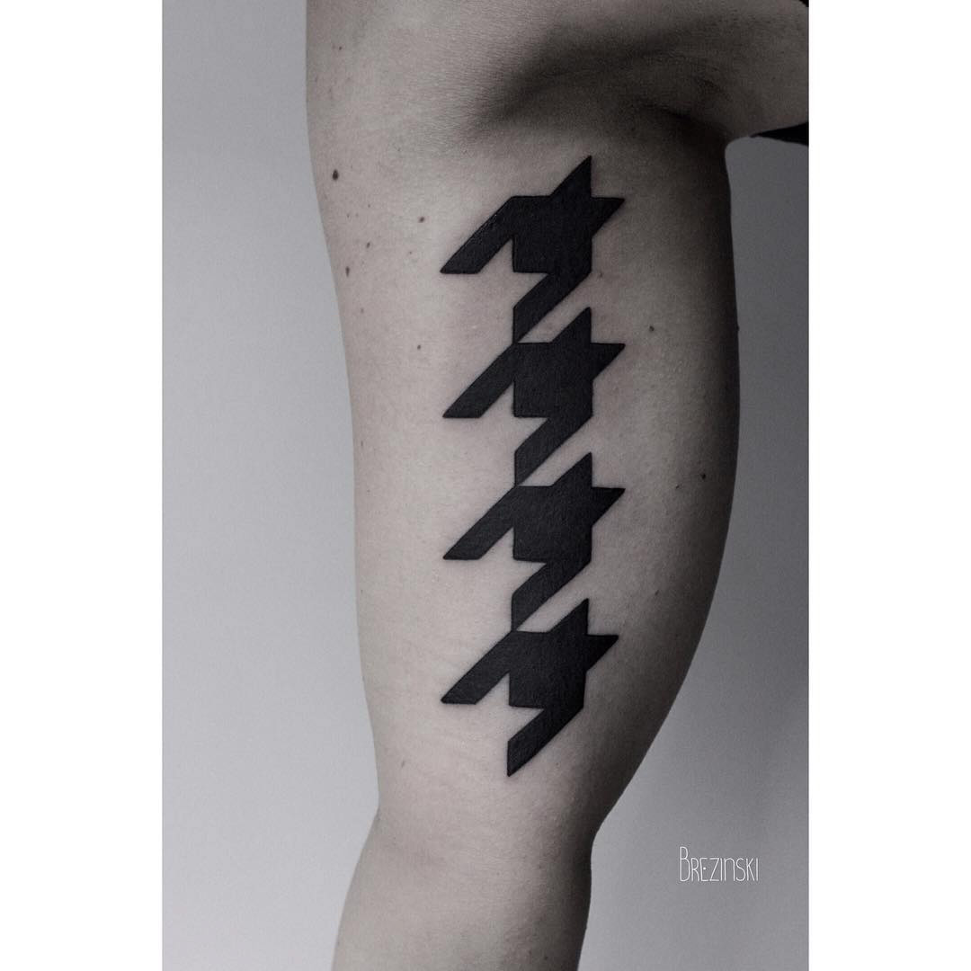 blackwork tattoo inner bicep