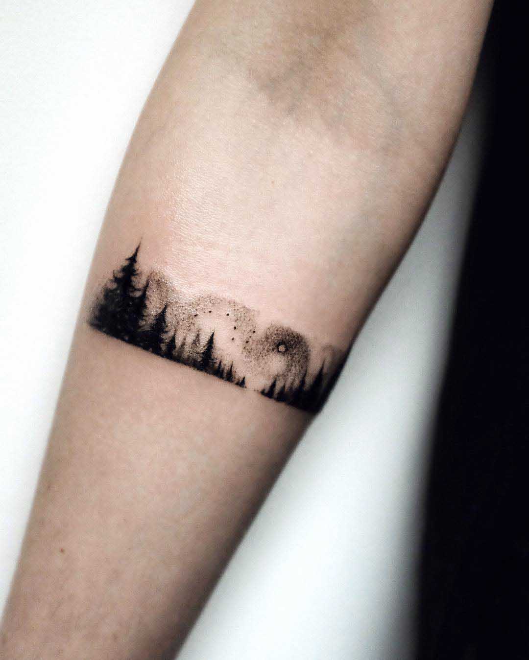 arm tattoo forest