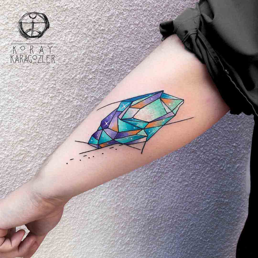 back arm crystal tattoo