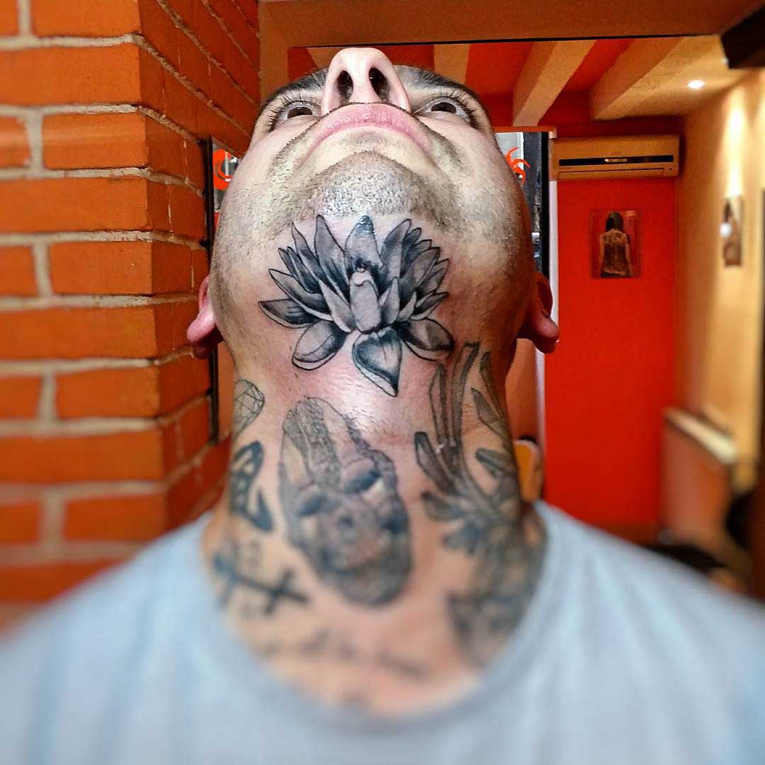 Lotus Chin Tattoo by miskotattoo