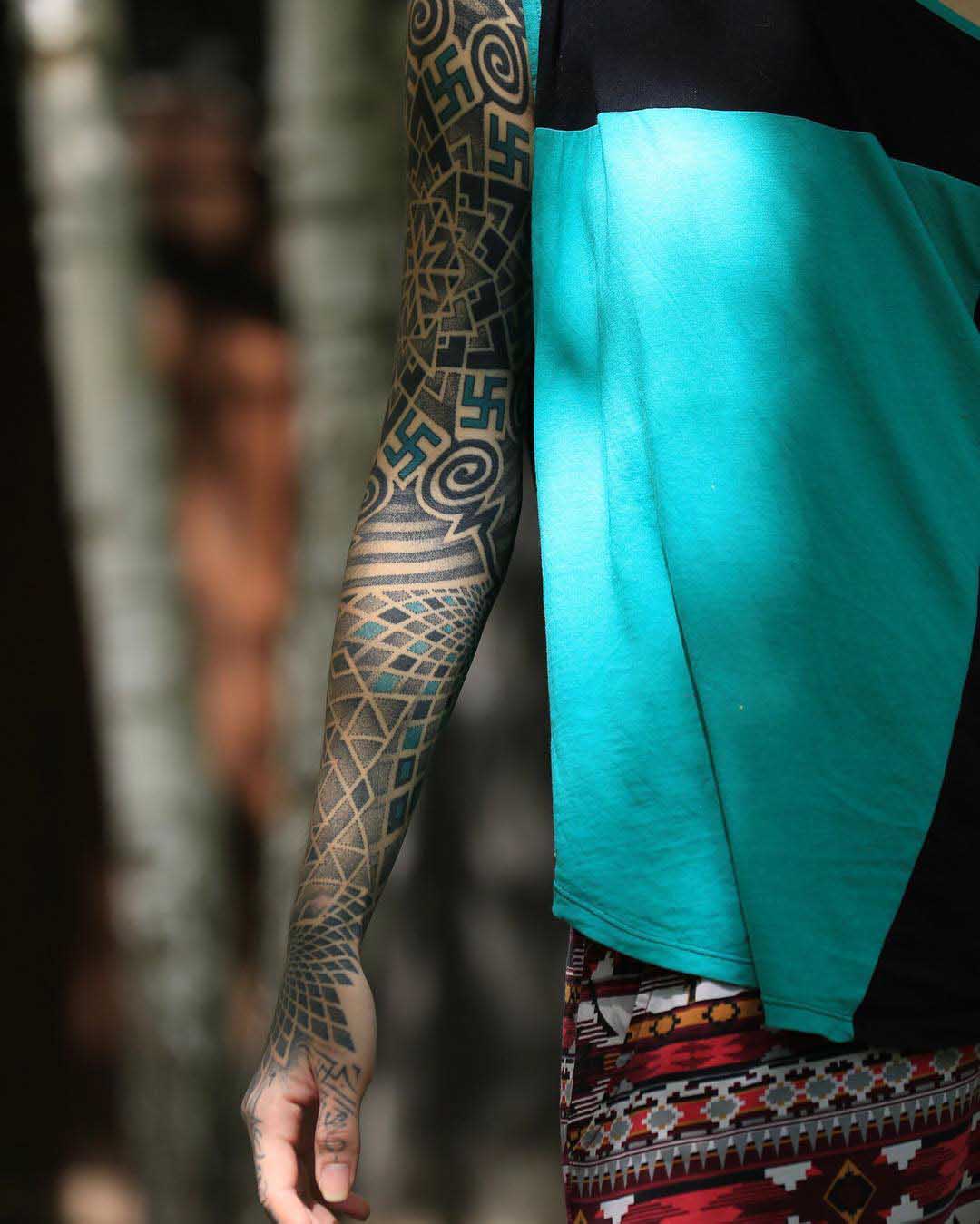 dotwork sleeve tattoo with swastikas