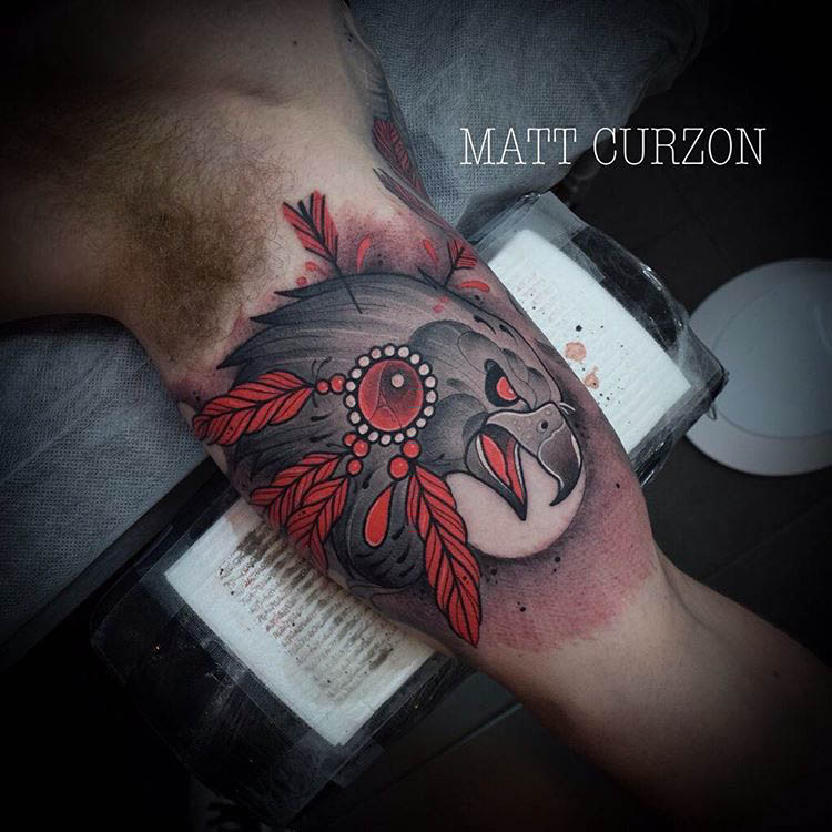 hawk tattoo on bicep