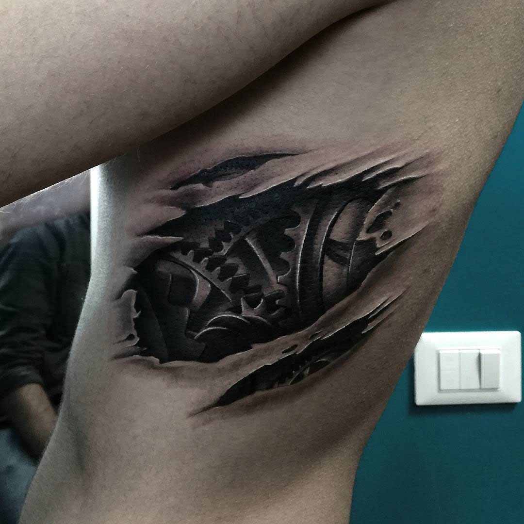 cogwheels tattoo biomechanical on ribs side