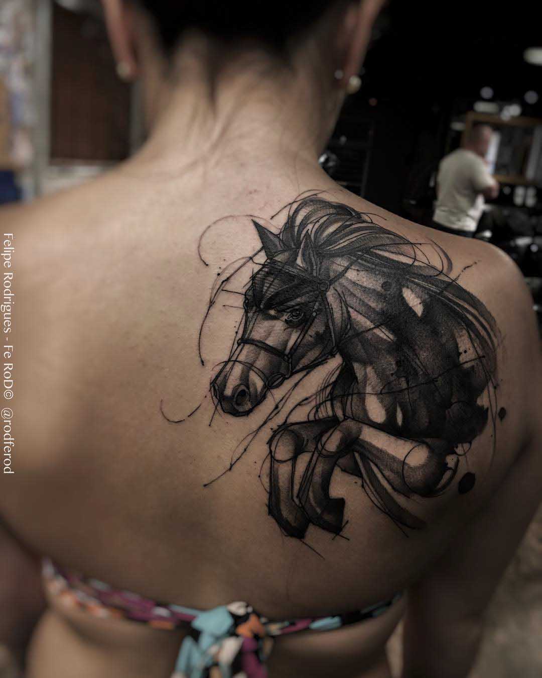 shoulder blade tattoo dark horse