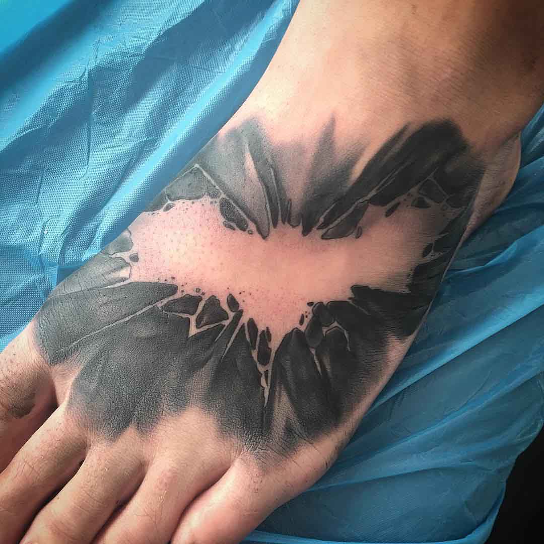 foot tattoo batmang emblem dark knight