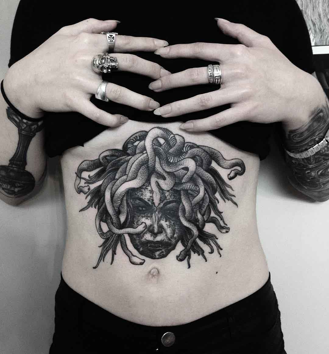 stomach tattoo bedusa head