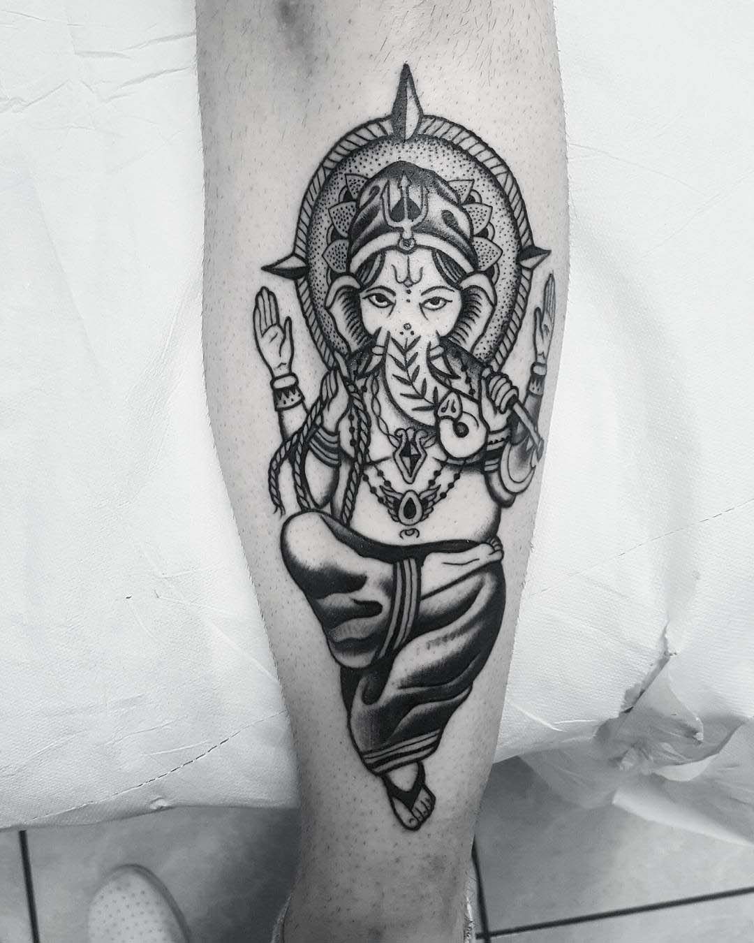 calf tattoo ganesha