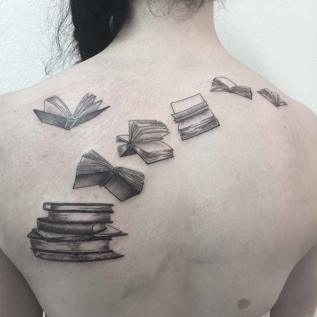 back tattoo books flying