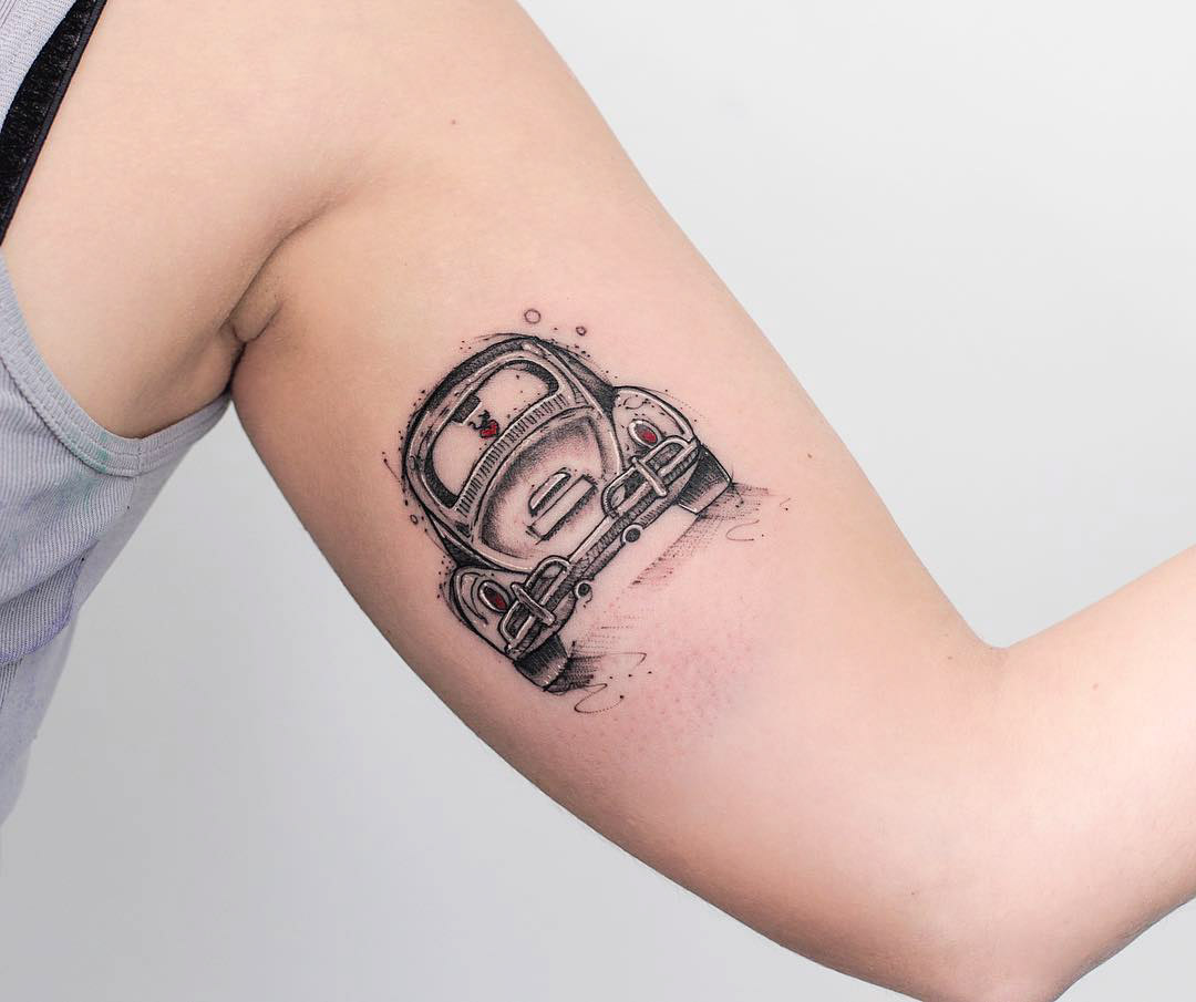 bicep tattoo of old car