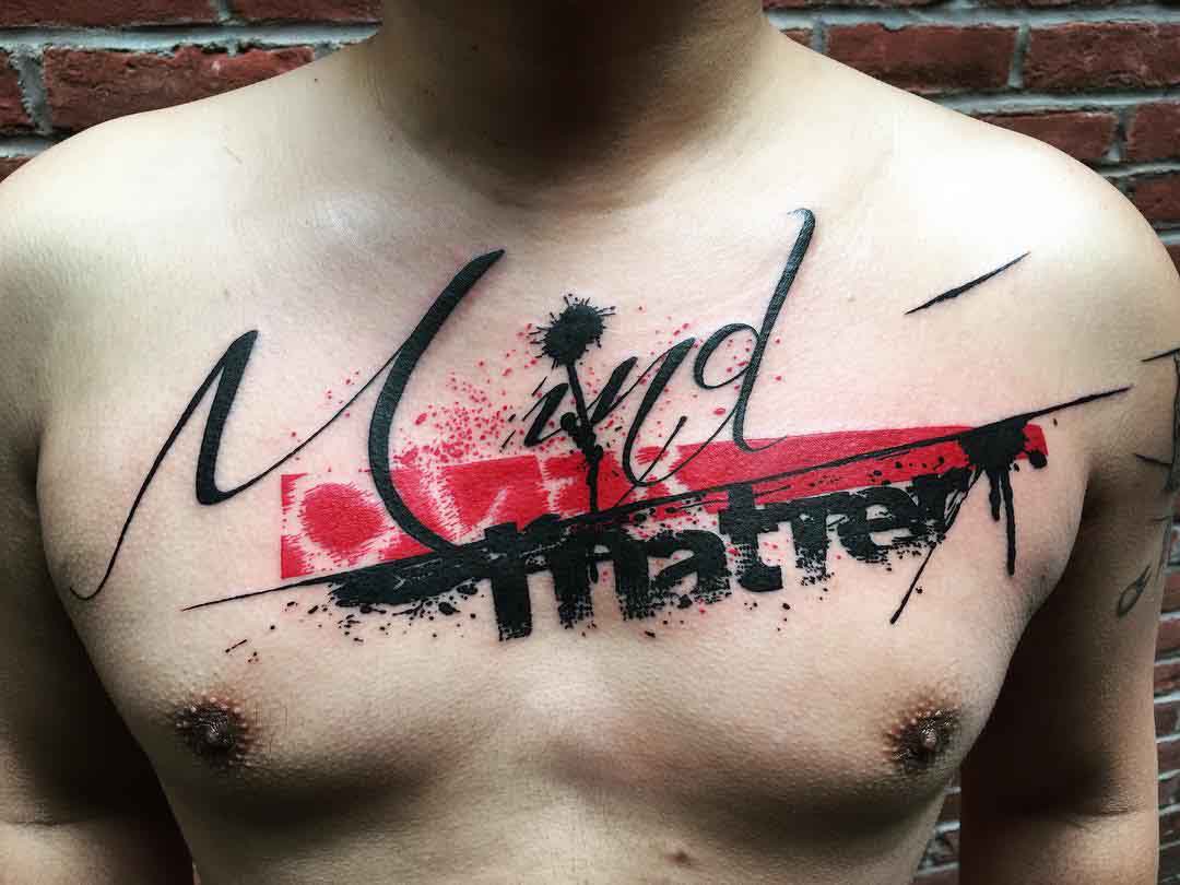 Chest trash polka tattoo lettering