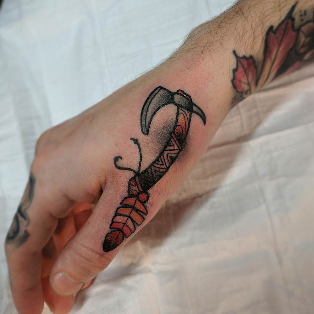 native tomahawk tattoo on thumb axe